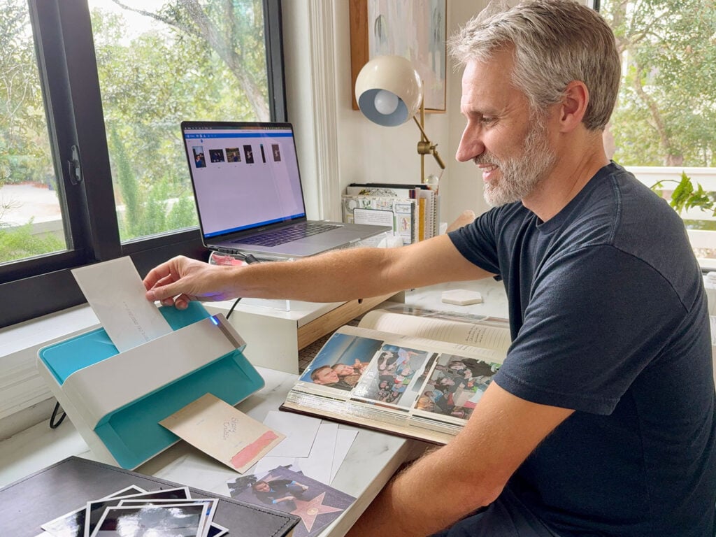 John Scanning Old Photos Albums to Digitize To Computer