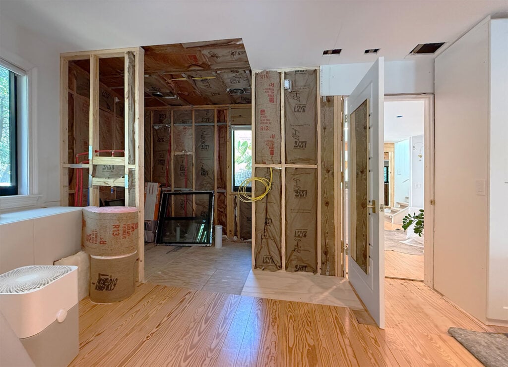 Wider View Of New Primary Bathroom In Bedroom During Renovation