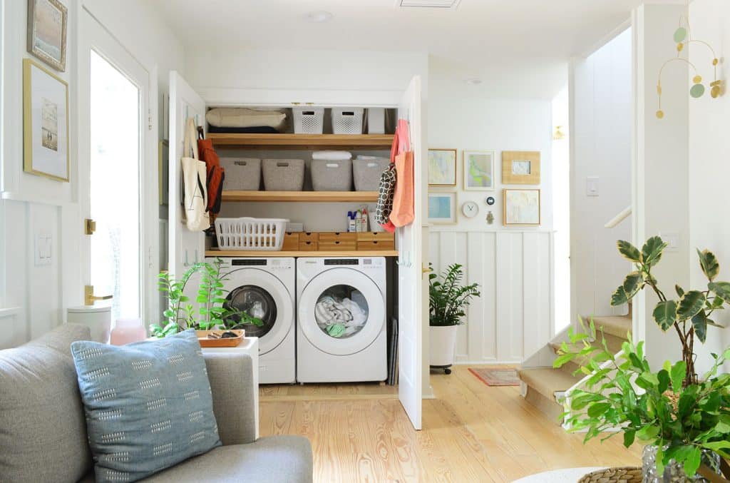 beachy-kitchen-laundry-both-doors-1024x677-1 View Of Open Laundry Closet Behind Seating Area In Kitchen