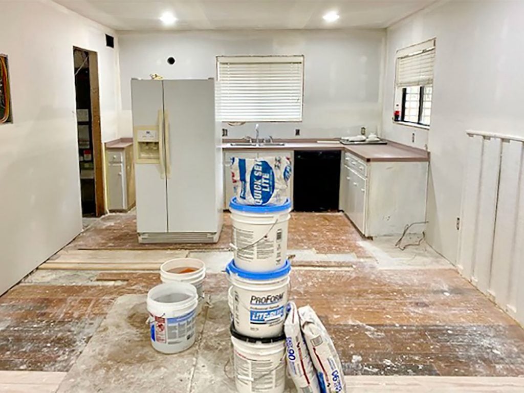 florida-renovation-progress-kitchen-redrywalled-1024x768-1 Kitchen Renovation With Dusty Floors And Refrigerator In The Middle Of The Room