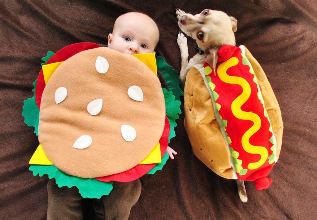 burger-dog-dressed-up-like-hot-dog-1024x709-1 Baby Dressed as Hamburger Next to Dog In Hot Dog Costume