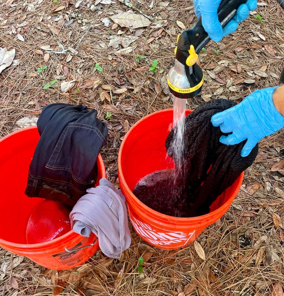 dye-clothes-rinsing-shirt-981x1024-1 Rinsing Black Dyed Clothes Of Excess Rit Dye Into Bucket