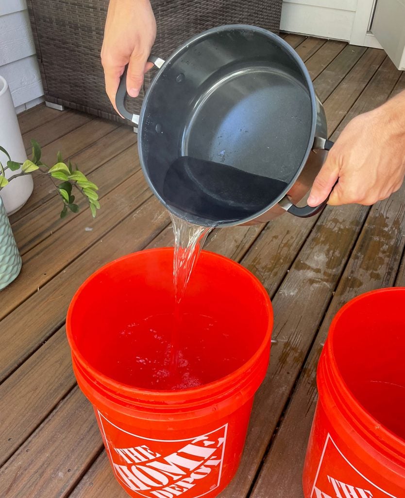 image Pouring Boiling Water Into Bucket For Fabric Dye