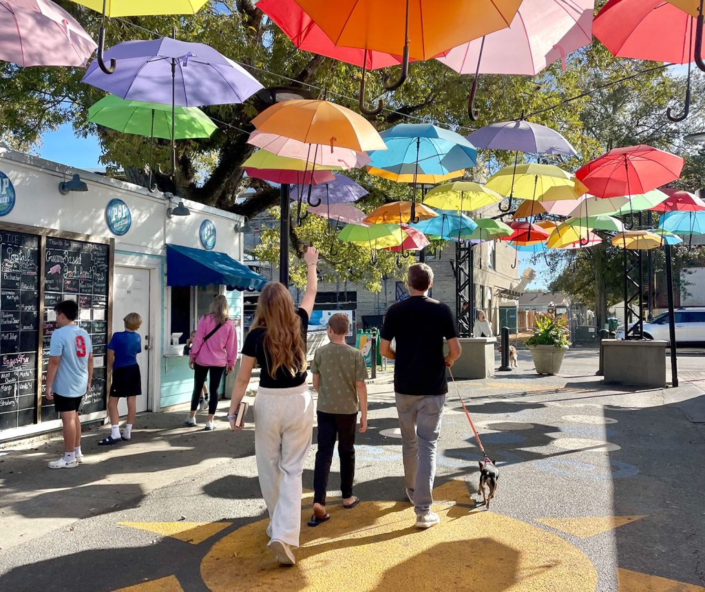 ocean-springs-featured-image-cash-alleys-1024x860-1 Kids Walking Under Bright Umbrellas In Cash Alley In Ocean Springs Mississippi