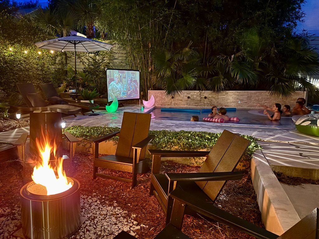 outdoor-movie-night-backyard-from-firepit-1024x768-2 Backyard Pool Area With Firepit And Outdoor Movie Screen
