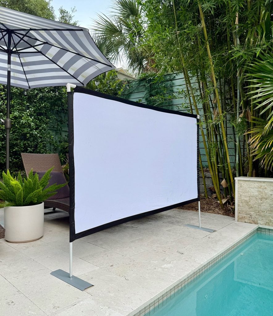 outdoor-movie-night-collapsible-screen-set-up-884x1024-1 Collapsible Screen Set Up By Pool For Outdoor Movie Night