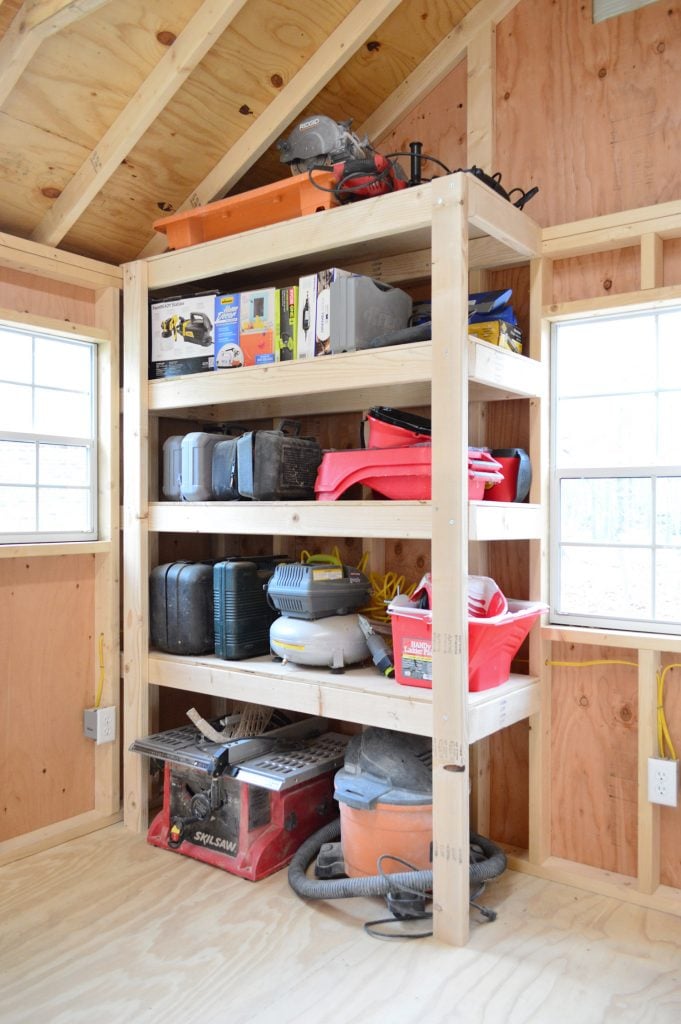 shed-storage-wood-shelves-after-681x1024-1 finished garage shelves in unfinished shed with tools and saws