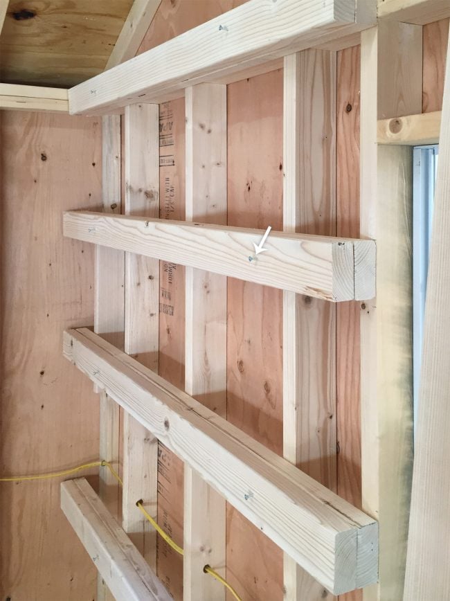 shed-storage-wood-shelves-second-boards-screwed-in-650x868-1 temporary screws into horizontal shelf supports for garage shelving