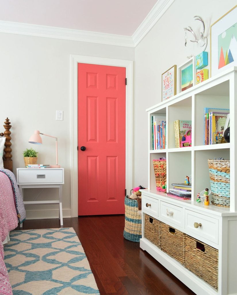 simply-white-trim-in-colorful-girls-bedroom-824x1024-1 Girls Bedroom With Greige Walls And Simply White Trim And Pink Door