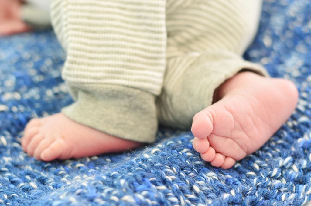 baby-boy-newborn-feet-1024x681-1 Small Newborn Baby Boy Feet On Blue Crochet Blanket