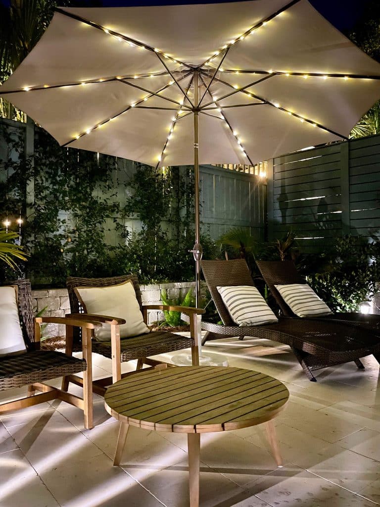 backyard-solar-light-umbrella-at-night-768x1024-1 Pool Patio Umbrella Lit Up With Solar LED Lights