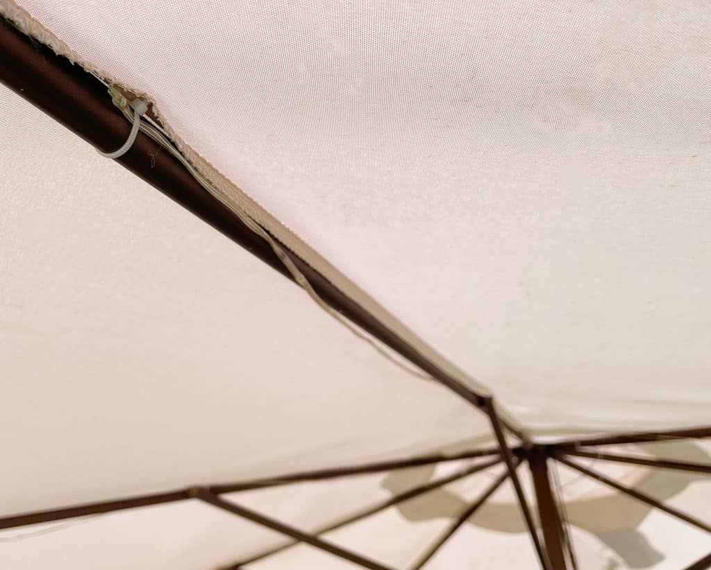 backyard-solar-light-umbrella-zip-ties-1024x822-1 Underside View Of Patio Umbrella With LED Solar Lights Attached With Zip Tie