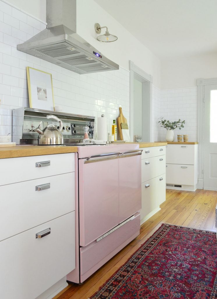 beach-house-kitchen-pink-stove-backsplash-angle-745x1024-1 beach house kitchen with pink stove and white subway backsplash