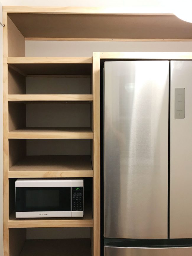 beach-house-pantry-face-strips-done-650x867-1 left side of built in pantry shelving with all face pieces installed