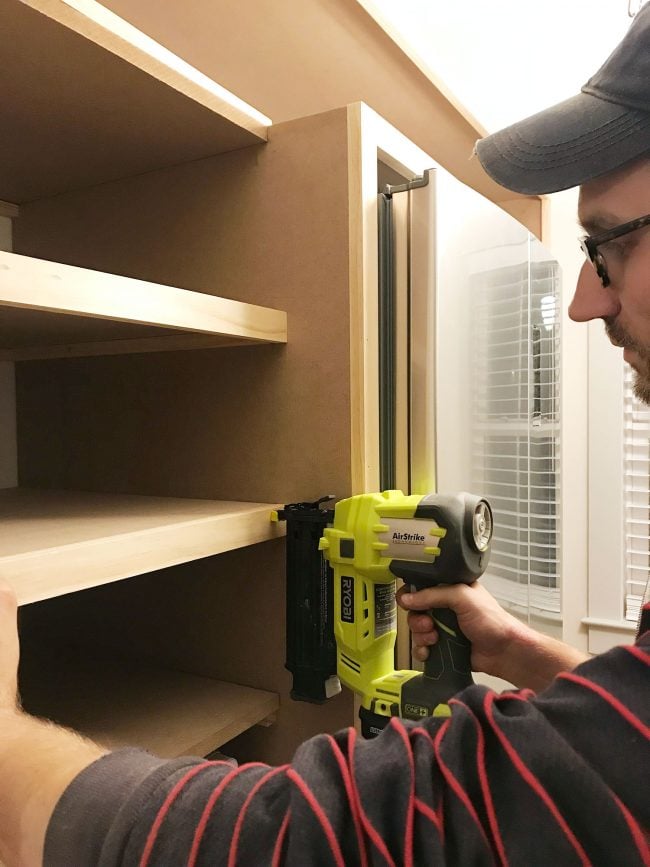 beach-house-pantry-facing-strips-john-nailing-650x867-1 John nailing face pieces onto pantry shelves
