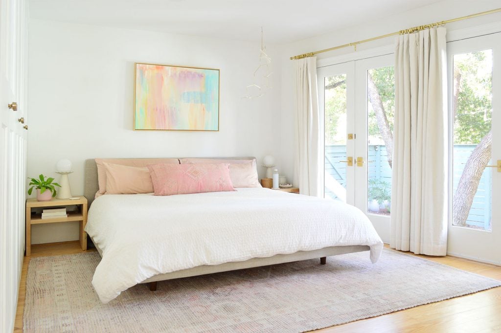 beachy-bedroom-bed-with-doors-closed-1024x681-1 Bright Beachy Bedroom With Colorful Painting And French Door Overlooking Yard