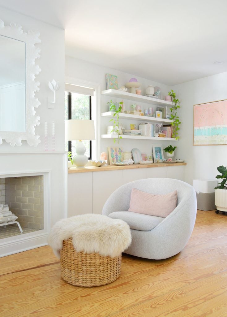 beachy-bedroom-fireplace-with-swivel-chair-734x1024-1 West Elm Swivel Chair In Beachy Bedroom With Ikea Lack Shelves In Background