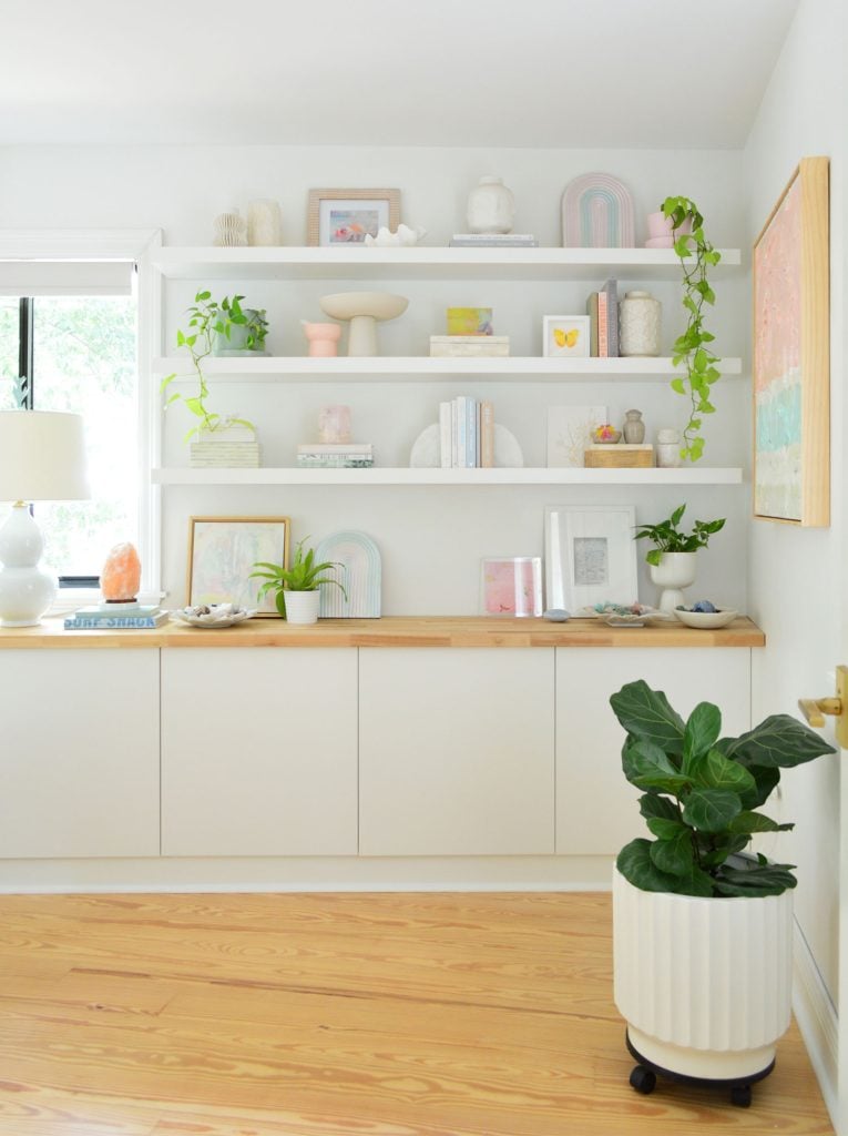 bedroom-floating-frames-full-vertical-765x1024-1 Three Ikea Lack Floating Shelves Over Ikea Besta Storage Console With Butcher Block Counter