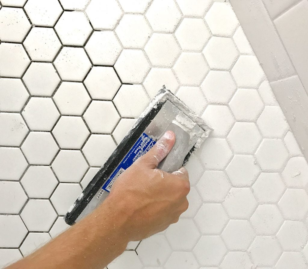 best-grout-spreading-on-hex-tile-1024x895-1 Spreading grout into white hex tile with grout float