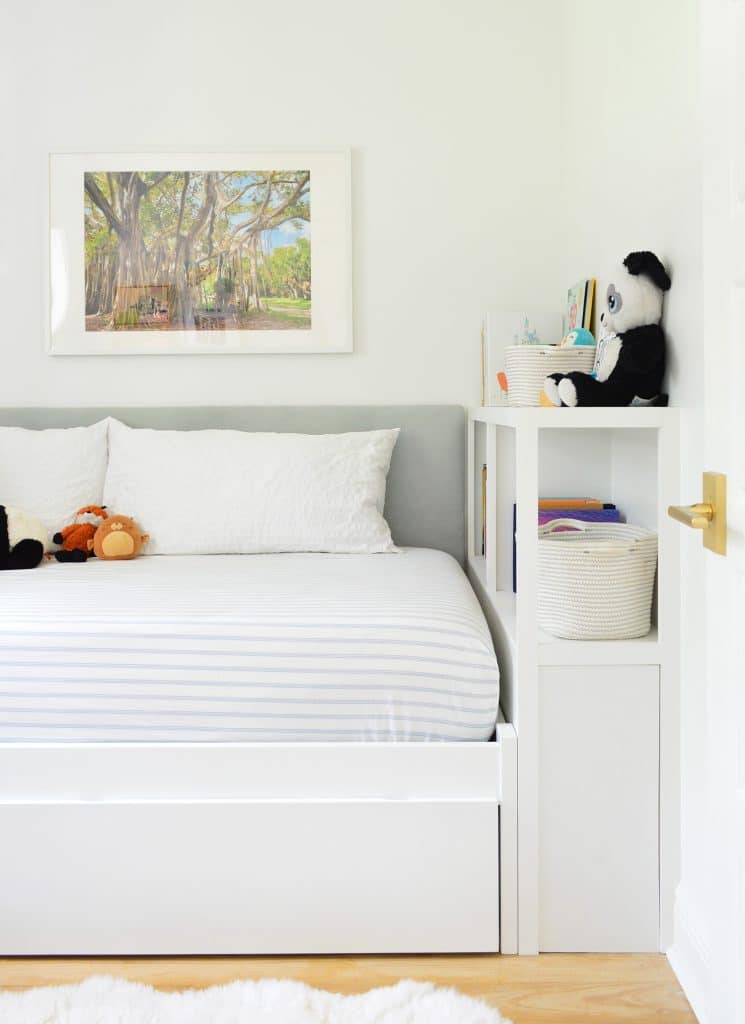 boys-bedroom-headboard-after-straight-books-745x1024-1 Boys bedroom with DIY fabric headboard and built-in bed with bookcase footboard