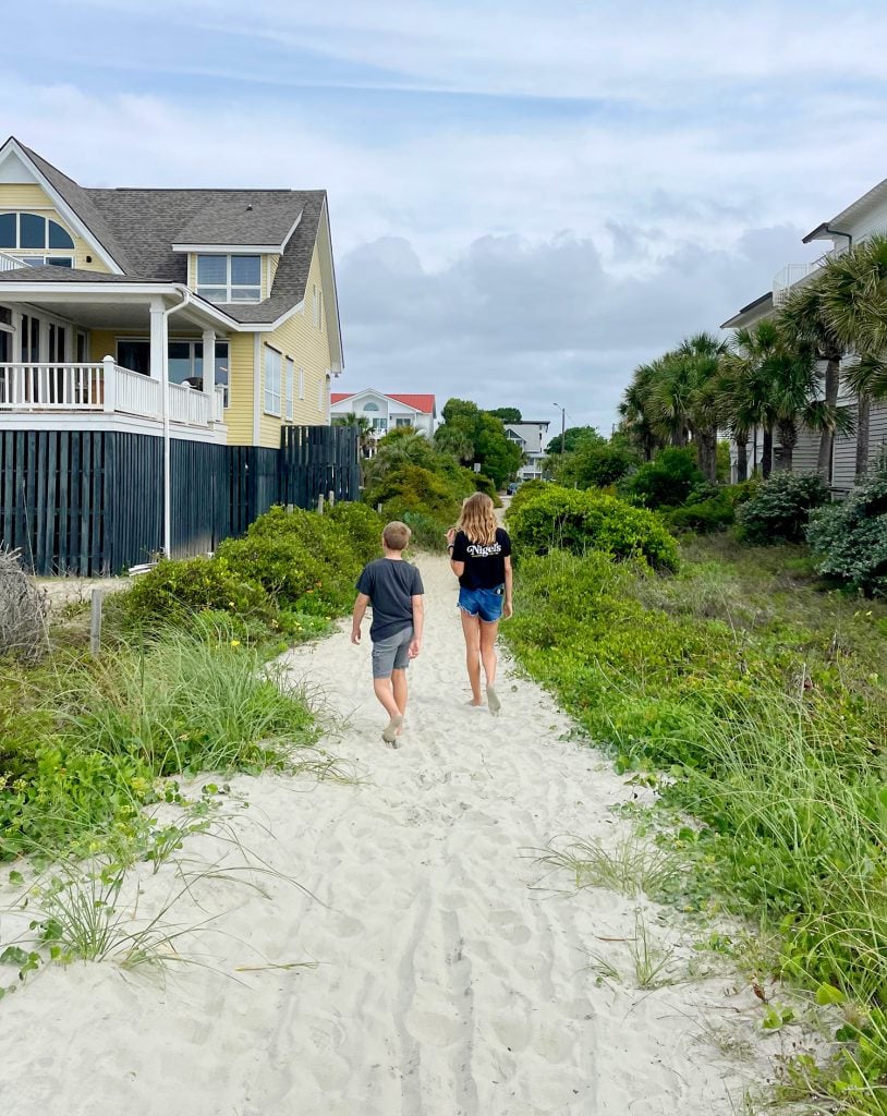 charleston-south-carolina-isle-of-palm-walkover-814x1024-1 Children Walking Down Beach Access At Isle Of Palms South Carolina