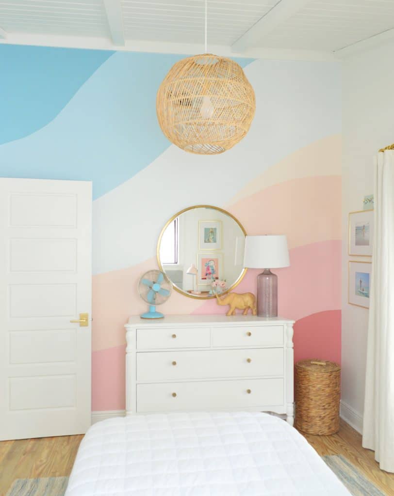 colorful-wall-mural-after-through-window-812x1024-1 Abstract painted mural in girls bedroom with pink and blue gradient stripes