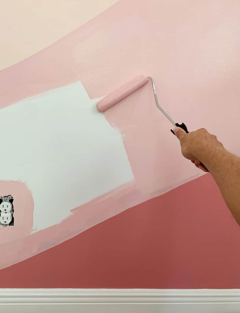 colorful-wall-mural-filling-in-pink-785x1024-1 Filling in abstract mural with paint roller