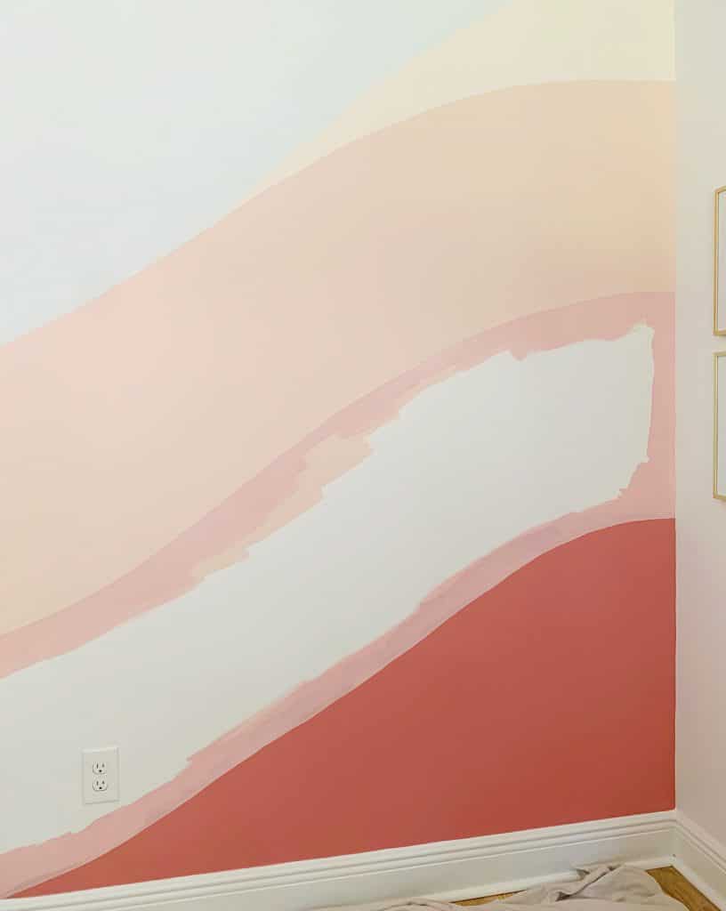 colorful-wall-mural-filling-pink-outlined-816x1024-1 Crisp edges of pink paint between two colors on abstract wall mural
