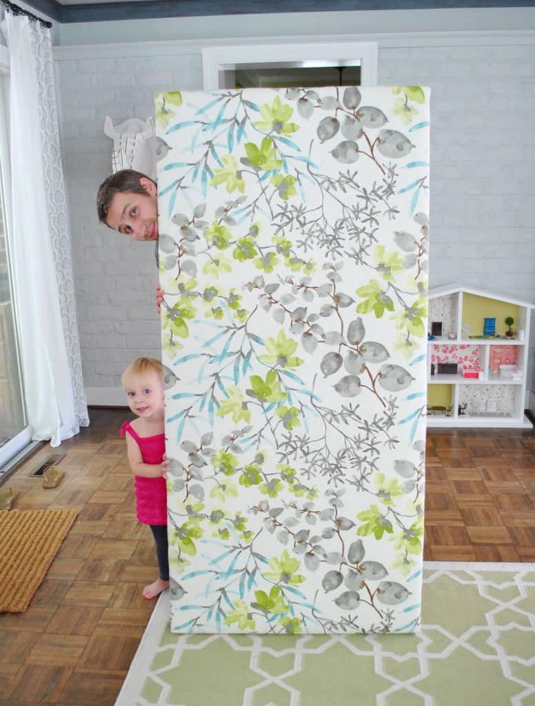 diy-upholstered-headboard-finished-fabric-with-john-776x1024-1 John standing with finished DIY fabric headboard