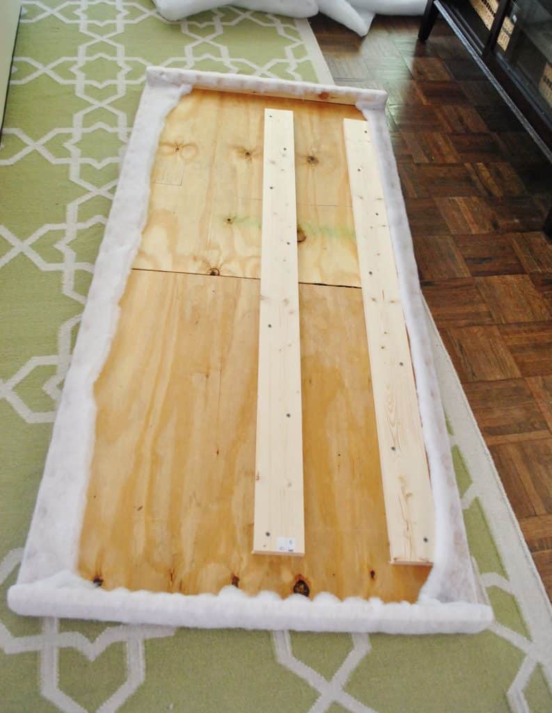 diy-upholstered-headboard-first-layer-batting-done-793x1024-1 Finished batting stapled to back of DIY headboard frame