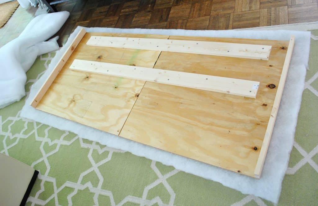 diy-upholstered-headboard-first-layer-of-batting-1024x666-1 Layer of batting placed under DIY headboard wood frame
