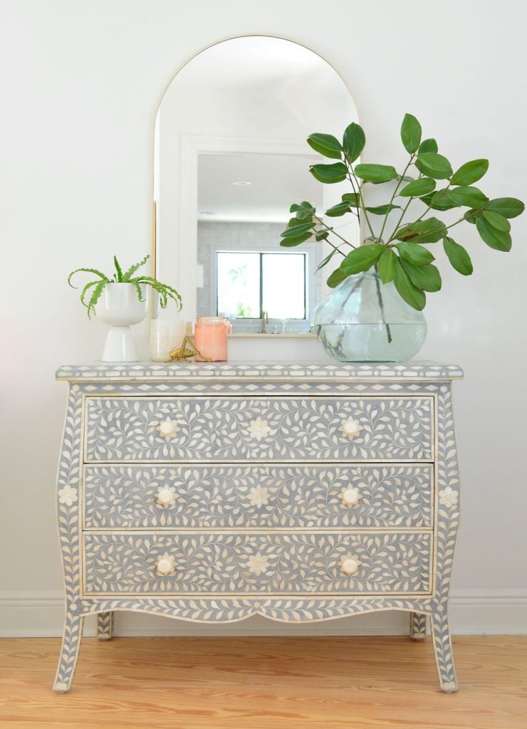 downsized-items-bedroom-dresser-740x1024-1 Blue and white inlay dresser with arch brass mirror and large plant vase