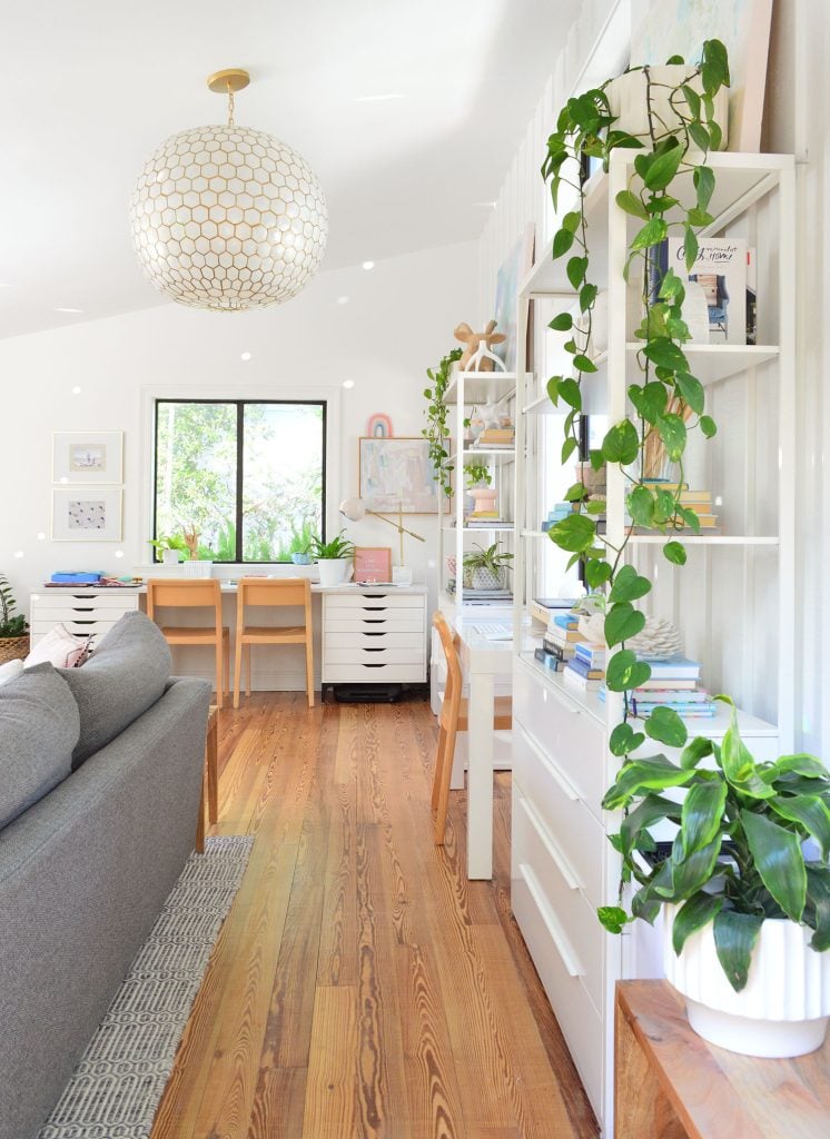 downsized-items-family-room-from-deck-746x1024-1 Upstairs family room with plants and Serena & Lily capiz pendant light