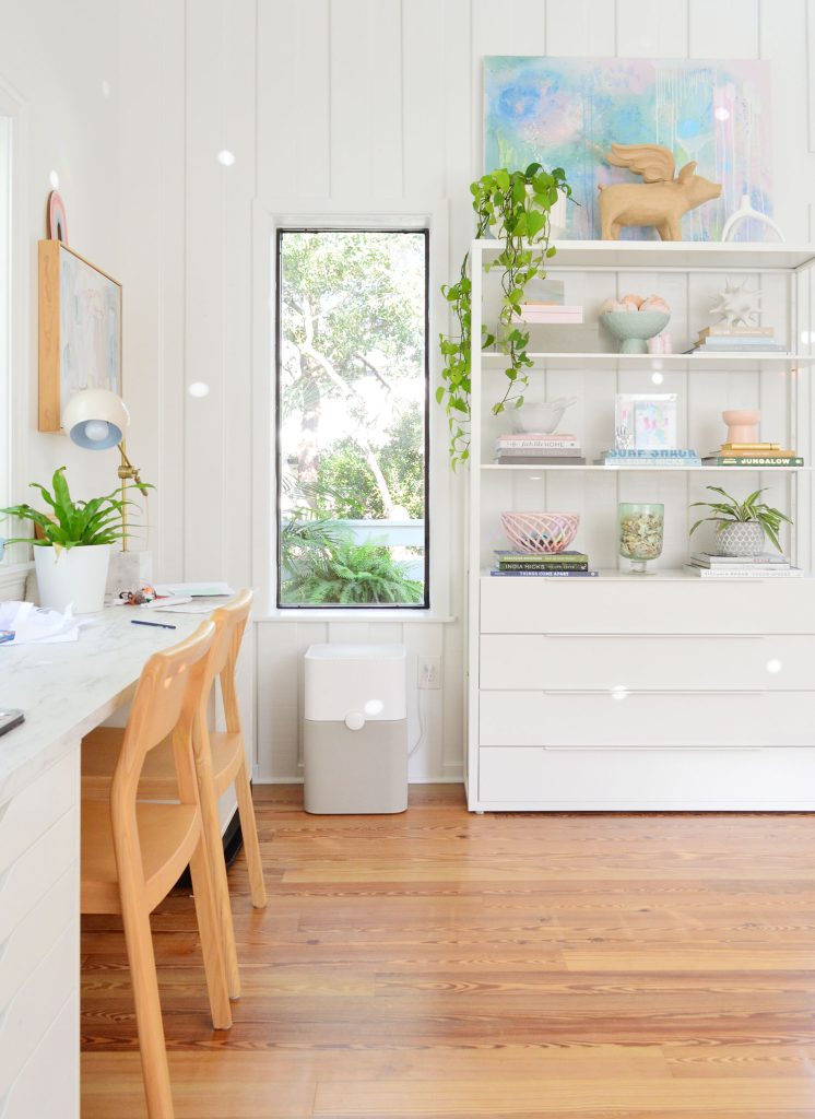downsized-items-family-room-from-stairs-vertical-746x1024-1 Ikea Fjalkinge shelf in upstairs office family room with artwork and plants