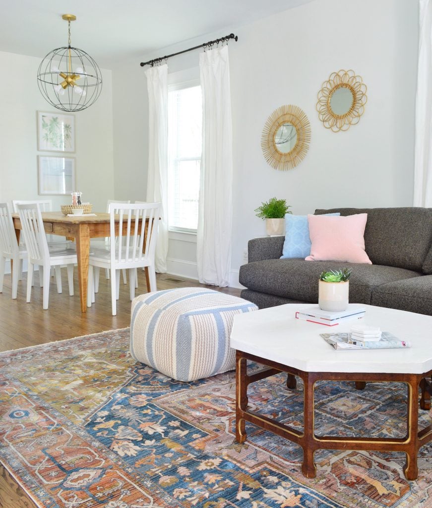 duplex-living-room-blue-from-entry-871x1024-1 Neutral Traditional Rug With Crate And Barrel Sofa And Pouf With Dining In Background