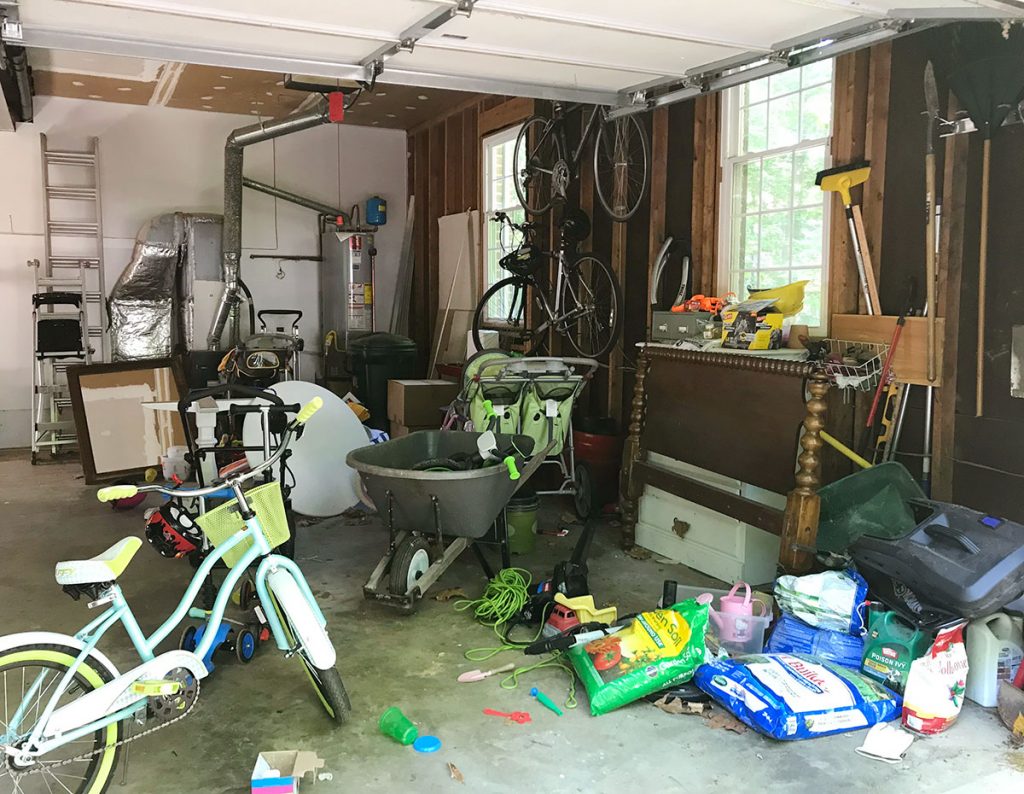ep97-garage-before-from-driveway-1024x794-1 Garage Filled With Junk Like Bikes And Yard Equipment