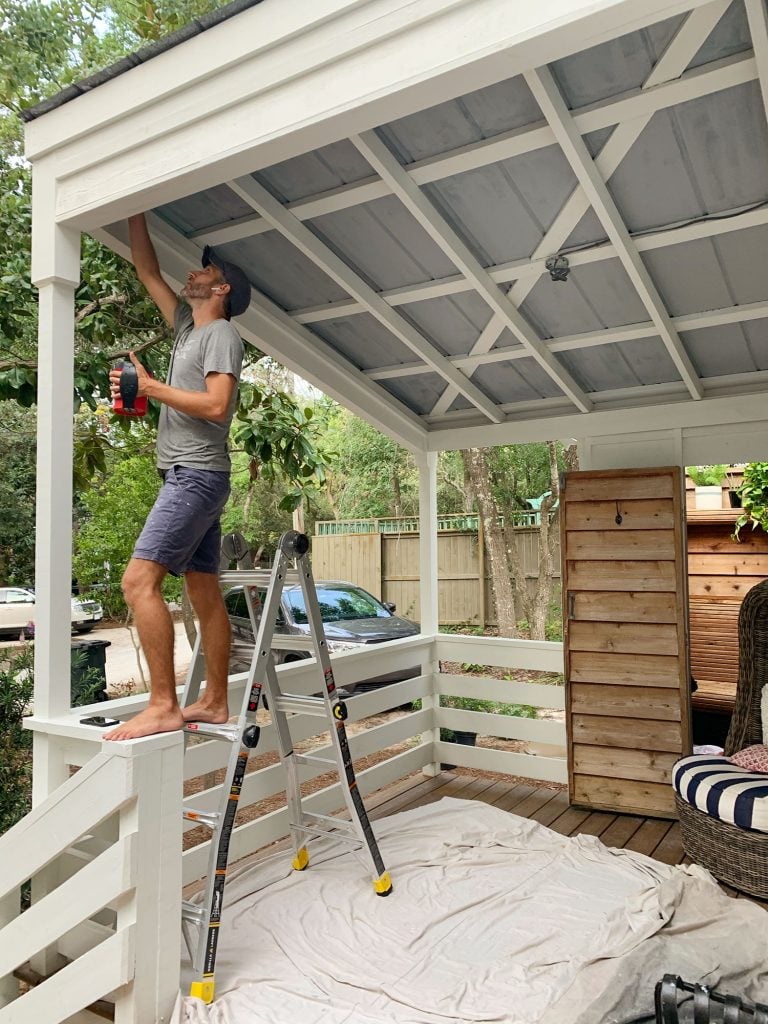 fall-front-porch-john-painting-ceiling-768x1024-1 John Standing On Ladder Priming Metal Porch Ceiling