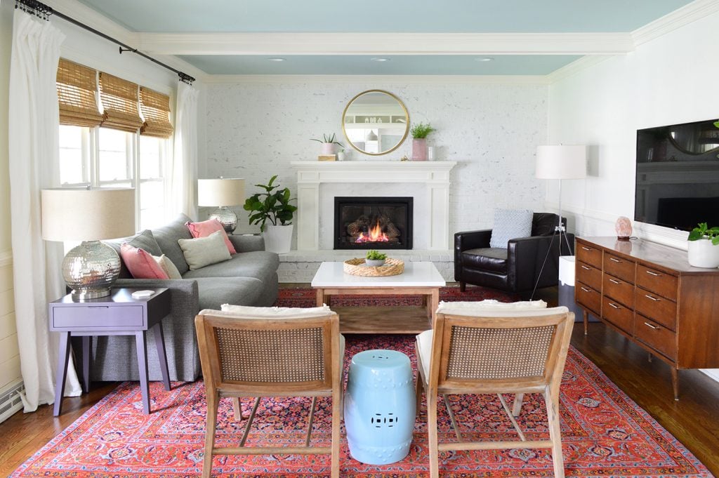 final-livingroom-2020-straight-on-1024x681-1 Large living room with white walls beams and traditional red rug
