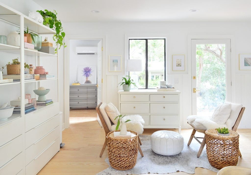 florida-kitchen-towards-front-door-horizontal-1024x712-1 Beachy sitting room with white shelves and large dressers with floating chairs and baskets