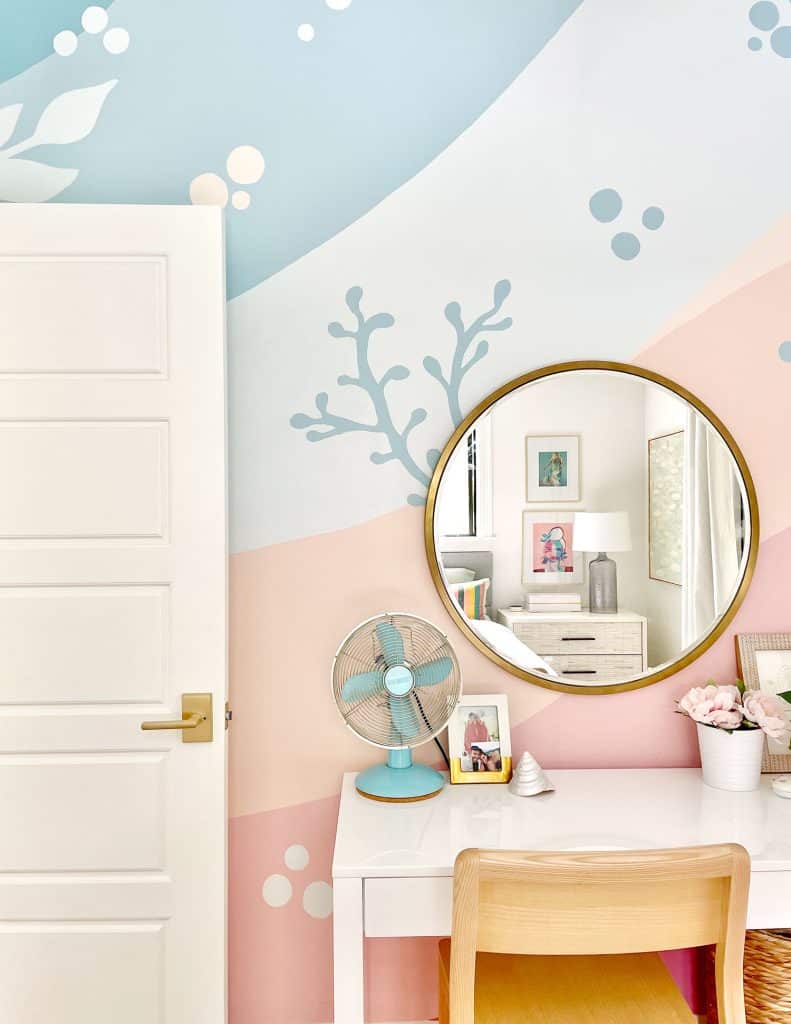 girls-bedroom-colorful-mural-gold-mirror-desk-791x1024-1 Colorful Girls Bedroom With Blue Pink Coral Beachy Mural With Gold Mirror Over Desk