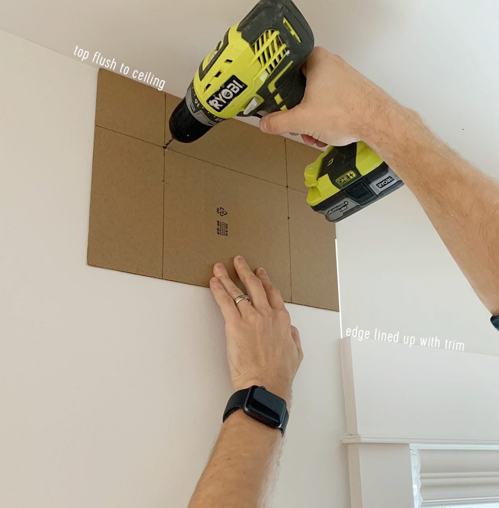 hanging-curtain-rods-drilling-with-template-1005x1024-1 Drilling through curtain rod hanging template to create pilot holes