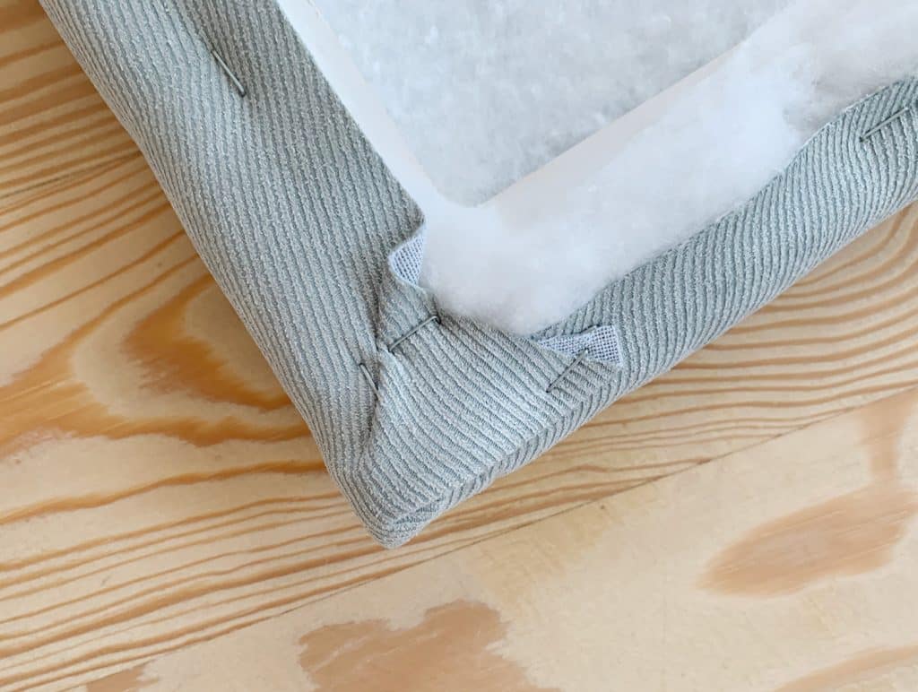 headboard-diy-fabric-corner-detail-1024x772-1 Detail of fabric stapled around corner of DIY headboard for boys bedroom
