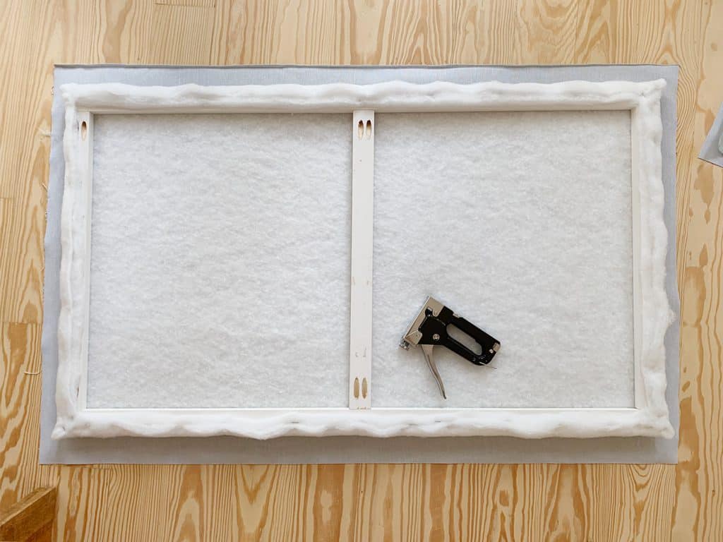 headboard-diy-fabric-ready-to-staple-1024x768-1 Batting covered wood frame laid on floor atop fabric prior to stapling