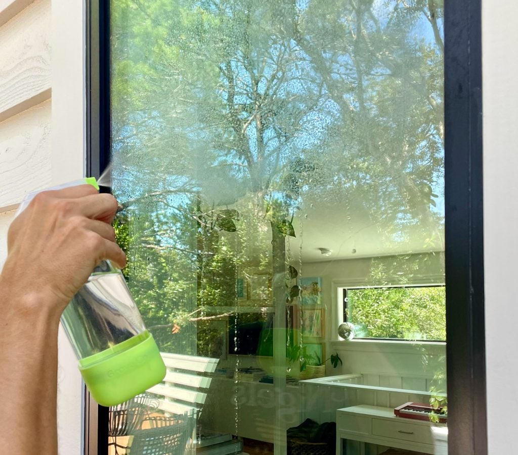 homemade-glass-cleaner-spraying-on-window-1024x901-1 Spraying Exterior Window With Homemade Glass Cleaner