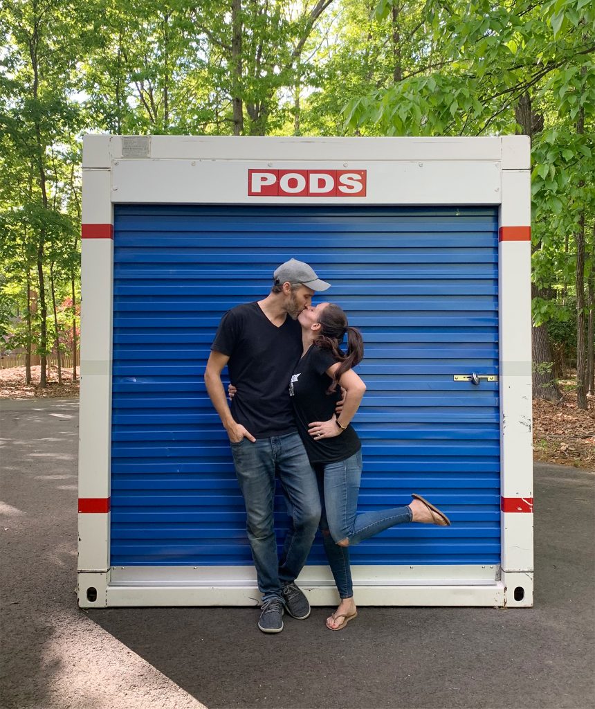 john-sherry-kissing-in-front-of-pods-860x1024-1 John and Sherry kissing in front of moving PODS storage container