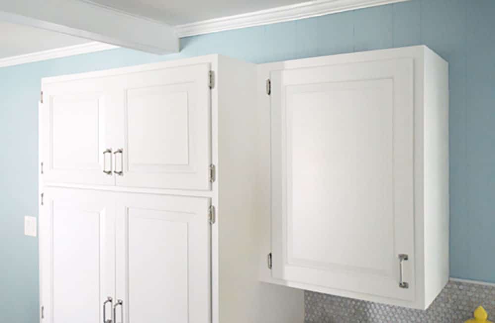 kitchen-crown-molding-top-before Top of white cabinets before crown molding is added