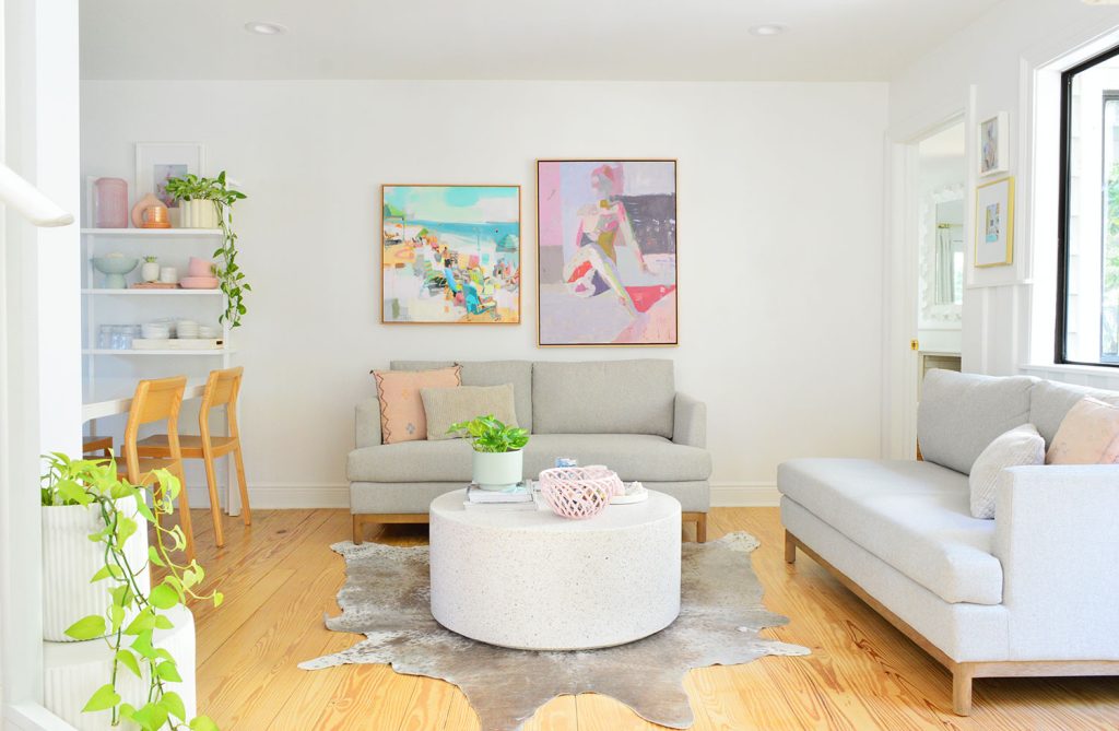 kitchen-sitting-area-two-loveseats-2023-1024x669-1 White Kitchen Sitting Area With Two Loveseats And Colorful Artwork