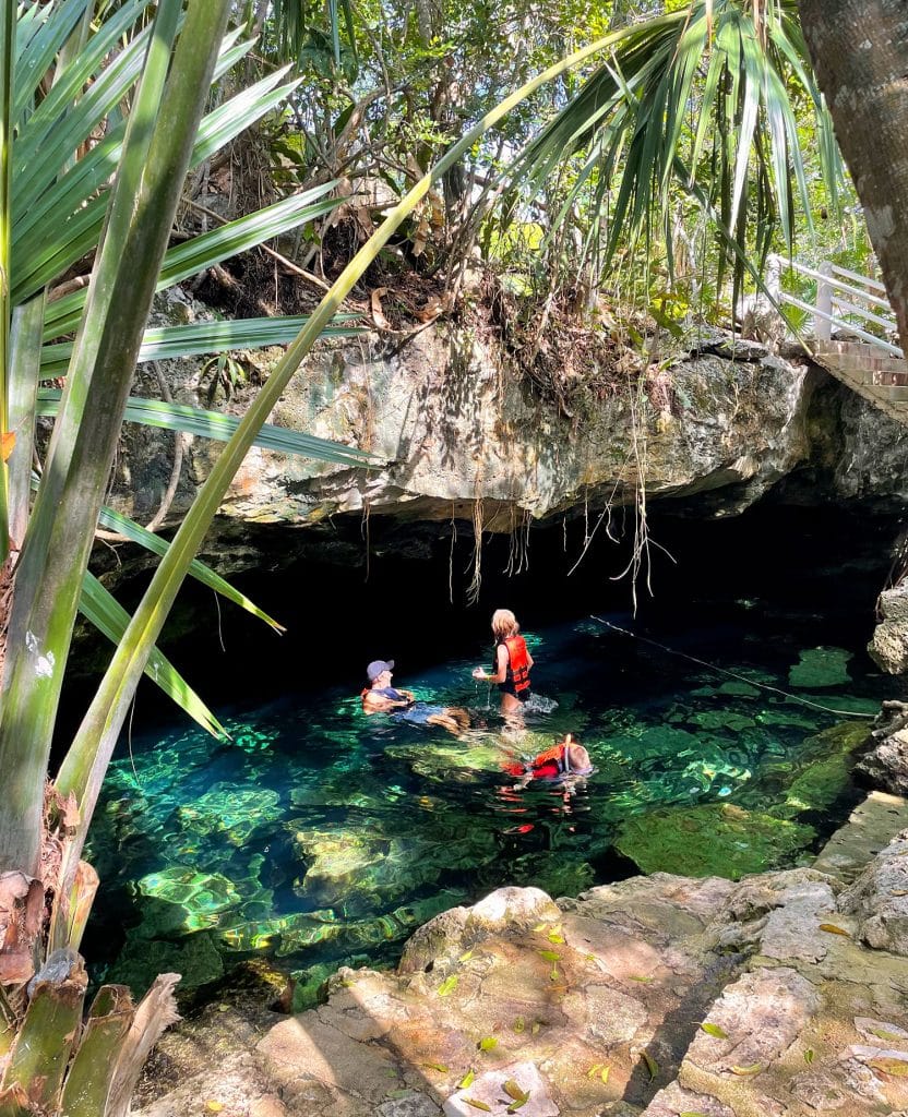 mexico-with-kids-cenote-cristalino-swimming-832x1024-1 Family Swimming Under Cave At Cenote Cristalino in Akumal Mexico