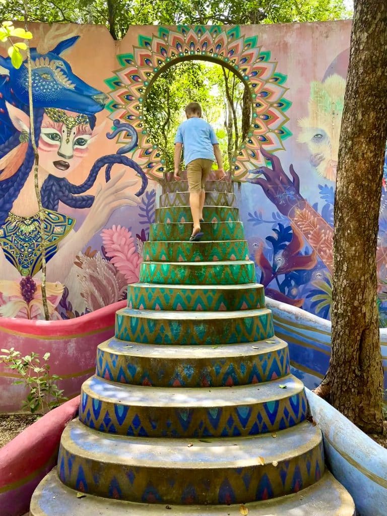 mexico-with-kids-holistika-art-walk-boy-walking-up-steps-768x1024-1 Boy Walking Up Steps Of Holistika Mural Art Walk