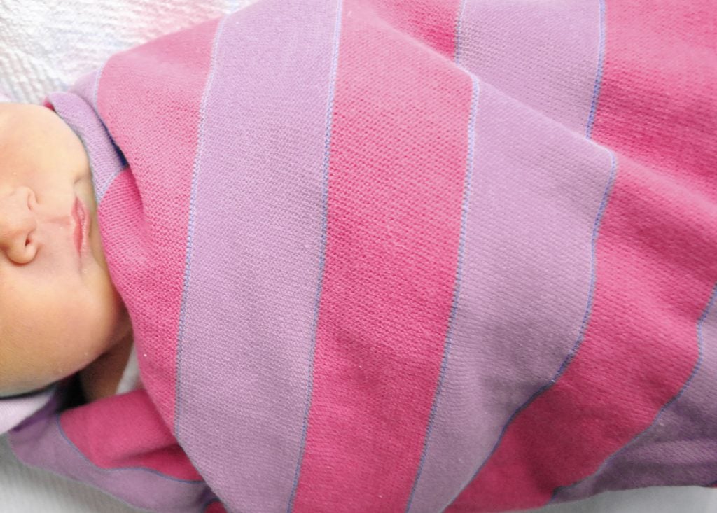 newborn-baby-girl-wrapped-in-pink-purple-blanket-1024x733-1 Pink Purple Baby Girl Blanket Wrapped Around Newborn